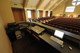 View of control station showing monitor mixer / console at rear of Church